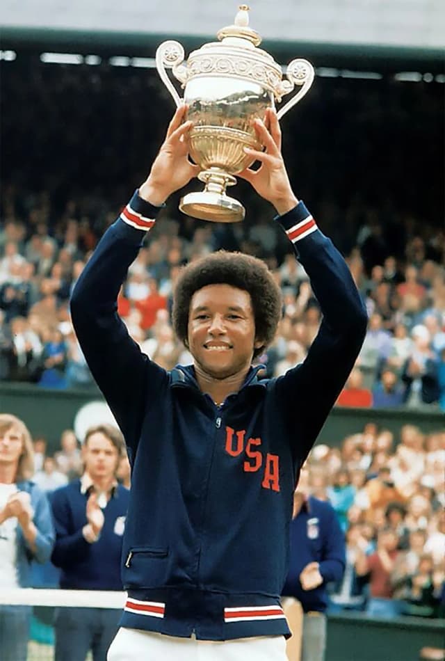 Arthur Ashe with trophy